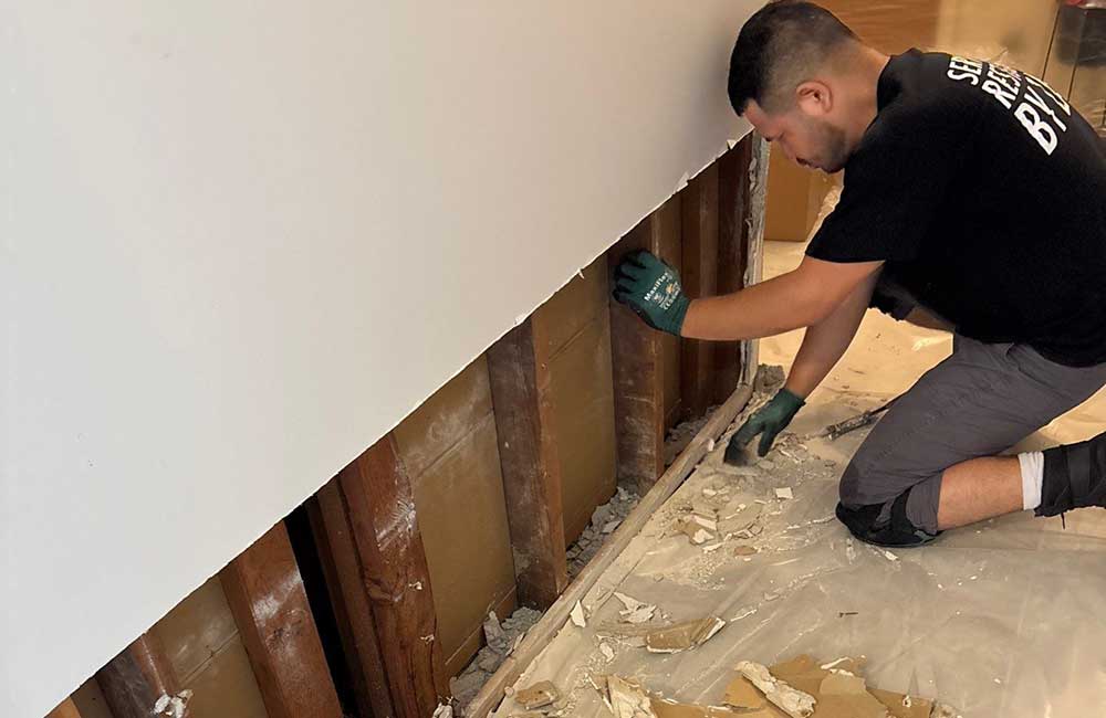 A man suggesting a repair job for water damage in Chicago
